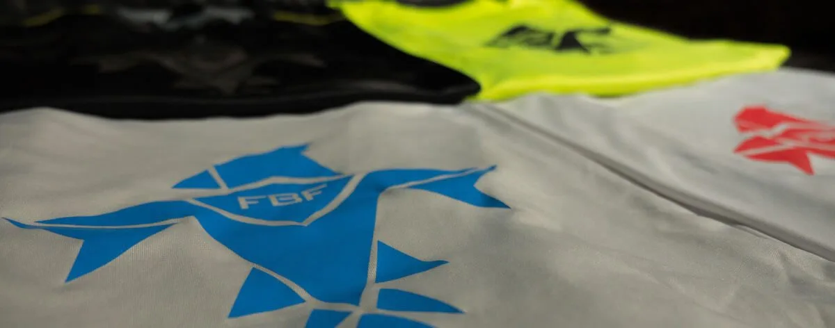 Falcon Blue Fitness tees laid out